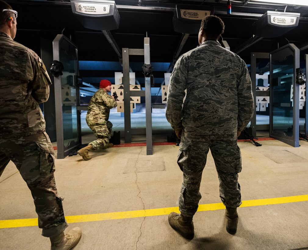 Staff Sgt. Jacob Ceglinski, 932d Security Forces combat arms instructor, demonstrates correct muzzle awareness during the M4 rifle qualification, Scott Air Force Base, Illinois, Feb. 8, 2020. The course sharpens their weapon systems skills and ensures optimal performance of the firearms they carry daily. (U.S. Air Force photo by Senior Airman Brooke Deiters)