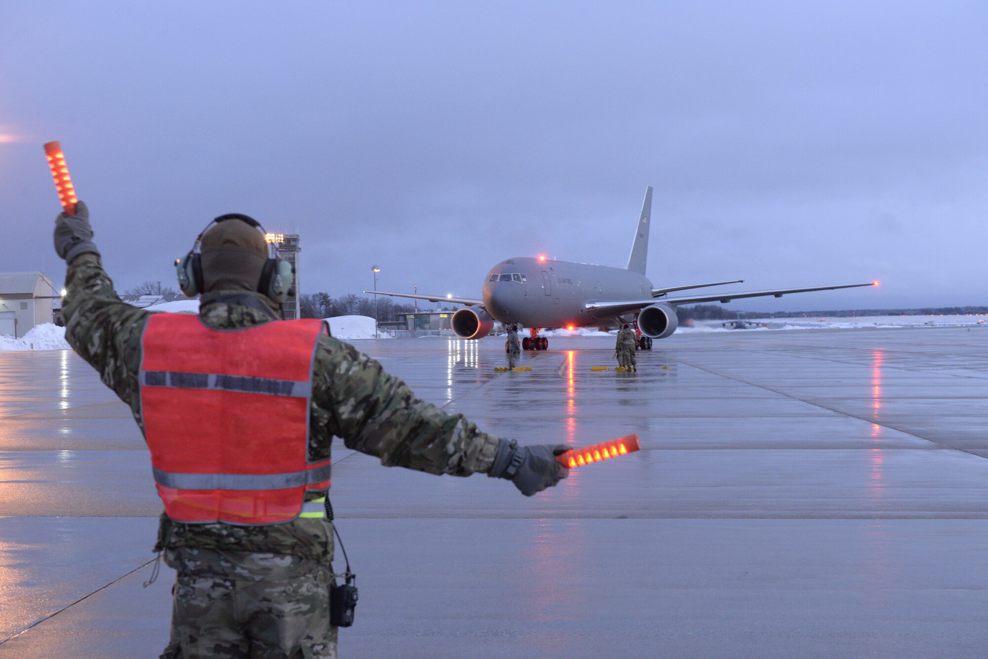 New Hampshire Air National Guard Staff Sgt. Joseph Chase, a flightline crew chief with the 157th Maintenance Squadron, marshals the Wing's fifth and newest KC-46A Pegasus air refueling tanker upon its arrival from Boeing, Feb. 7, 2020. Pease is slated to receive another seven aircraft in 2020. (U.S. Air National Guard photo by Tech. Sgt. Aaron Vezeau)
