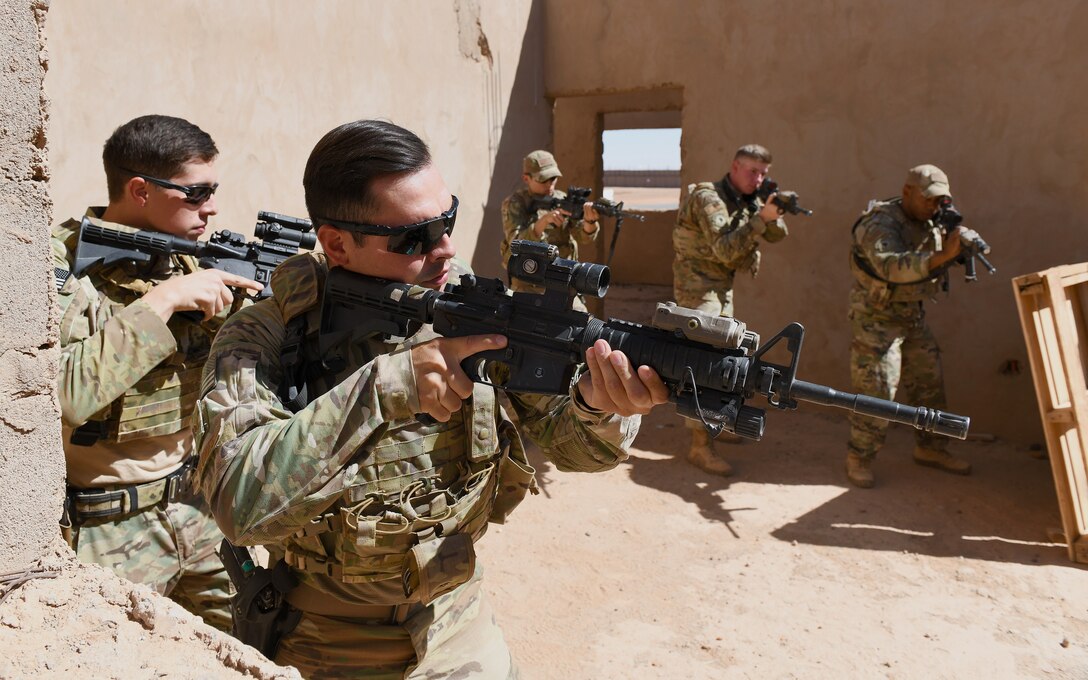 U.S. Air Force 409th Expeditionary Security Forces Squadron Response Force team members deployed to Nigerien Air Base 201 conduct building clearing procedures during a close quarters battle refresher course in Agadez, Niger, Feb. 5, 2020. During the course, the Defenders brushed up on the fundamentals of weapon manipulation, room clearing, and engaging threats with bystanders and hostages. (U.S. Air Force Photo by Tech. Sgt. Alex Fox Echols III)