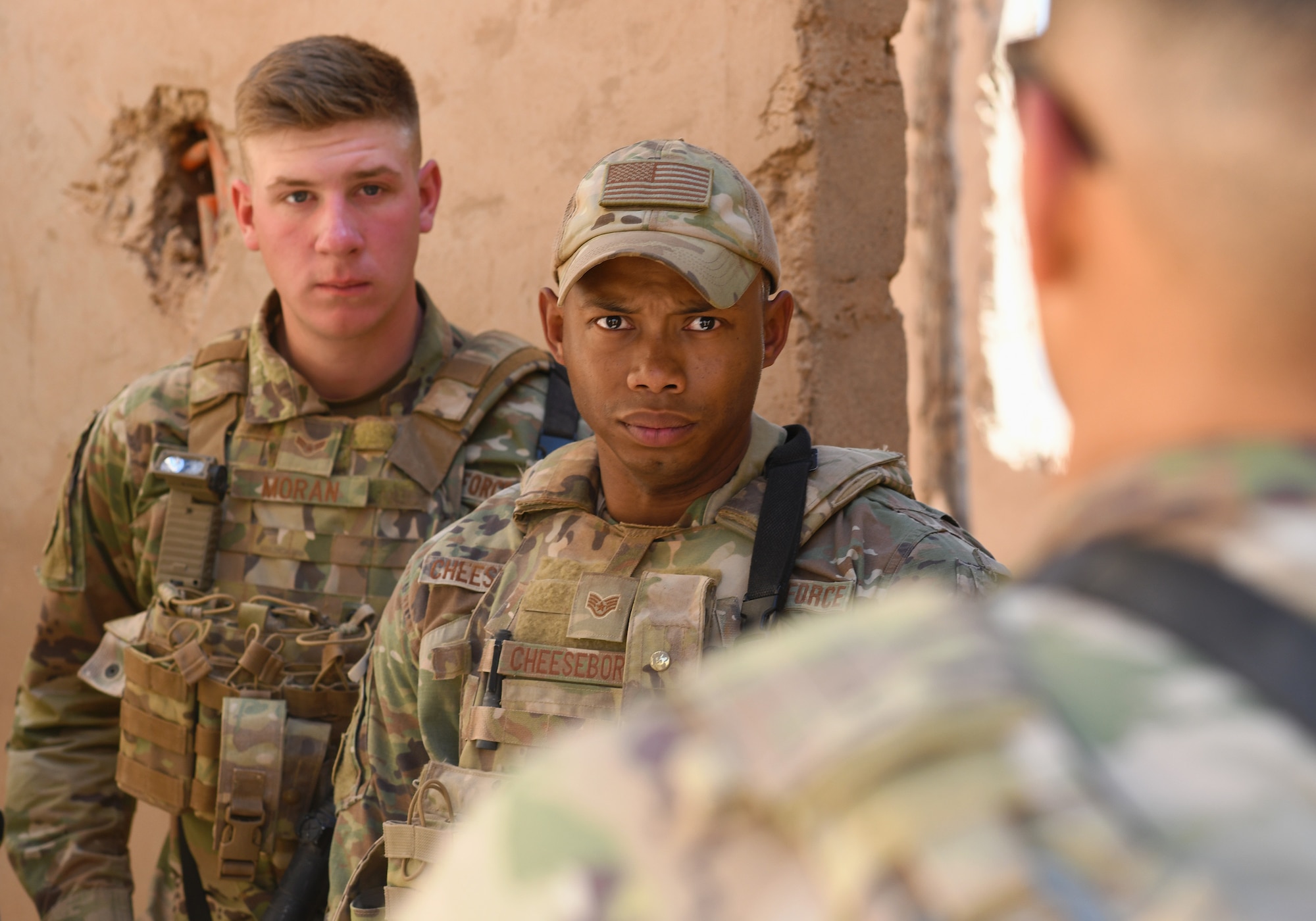 U.S. Air Force Staff Sgt. Noel Cheeseboro, center, and Airman 1st Class Ian Moran, left, 409th Expeditionary Security Forces Squadron Response Force team members, participate in a close quarters battle refresher course at Nigerien Air Base 201, Niger, Feb. 5, 2020. During the course, the Defenders brushed up on the fundamentals of weapon manipulation, room clearing, and engaging threats with bystanders and hostages. (U.S. Air Force Photo by Tech. Sgt. Alex Fox Echols III)