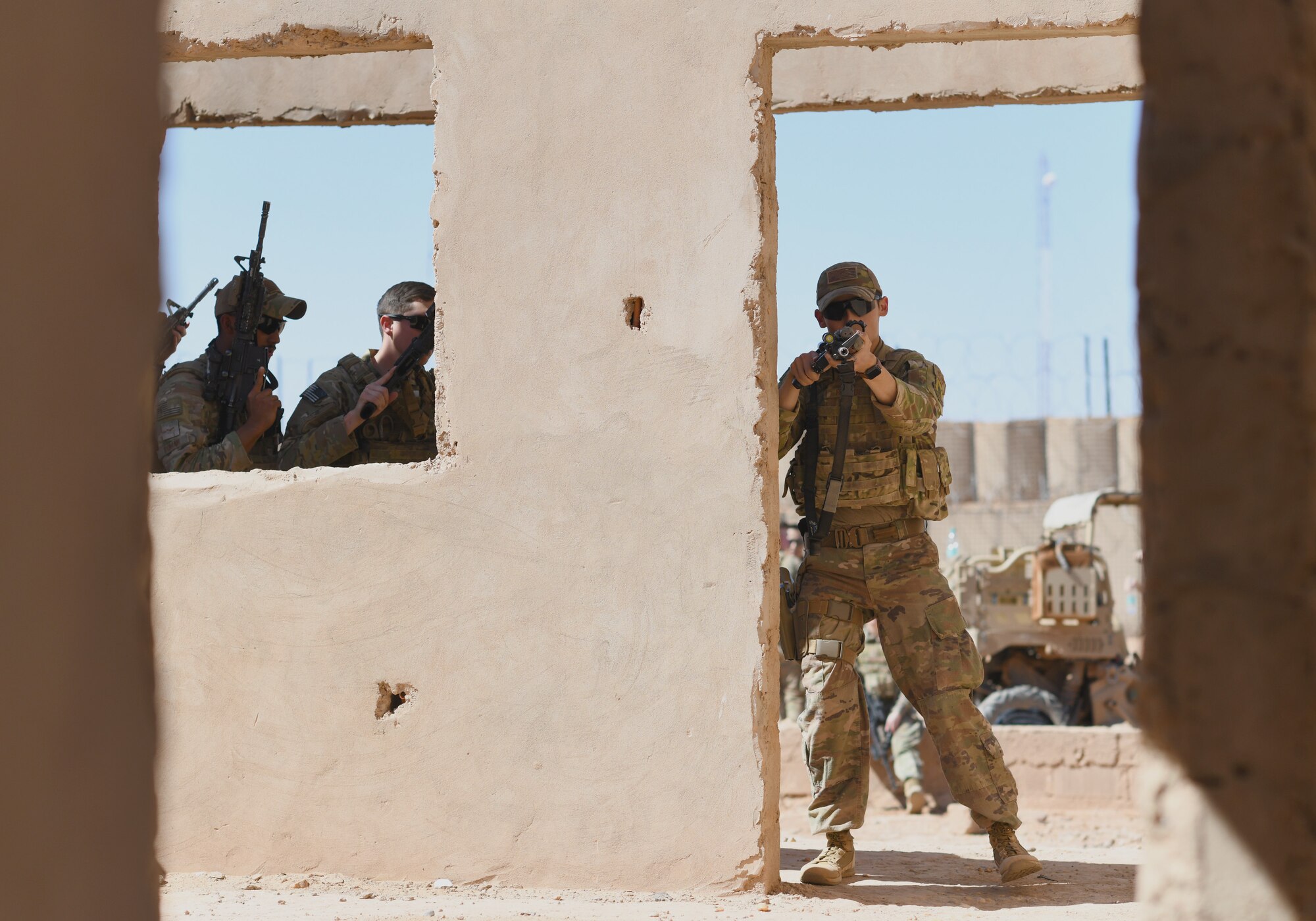 U.S. Air Force Senior Airman Hunter Fitchue, 409th Expeditionary Security Forces Squadron Response Force team member, enters a building during a close quarters battle training scenario at Nigerien Air Base 201, Niger, Feb. 5, 2020. During the course, the Defenders brushed up on the fundamentals of weapon manipulation, room clearing, and engaging threats with bystanders and hostages. (U.S. Air Force Photo by Tech. Sgt. Alex Fox Echols III)