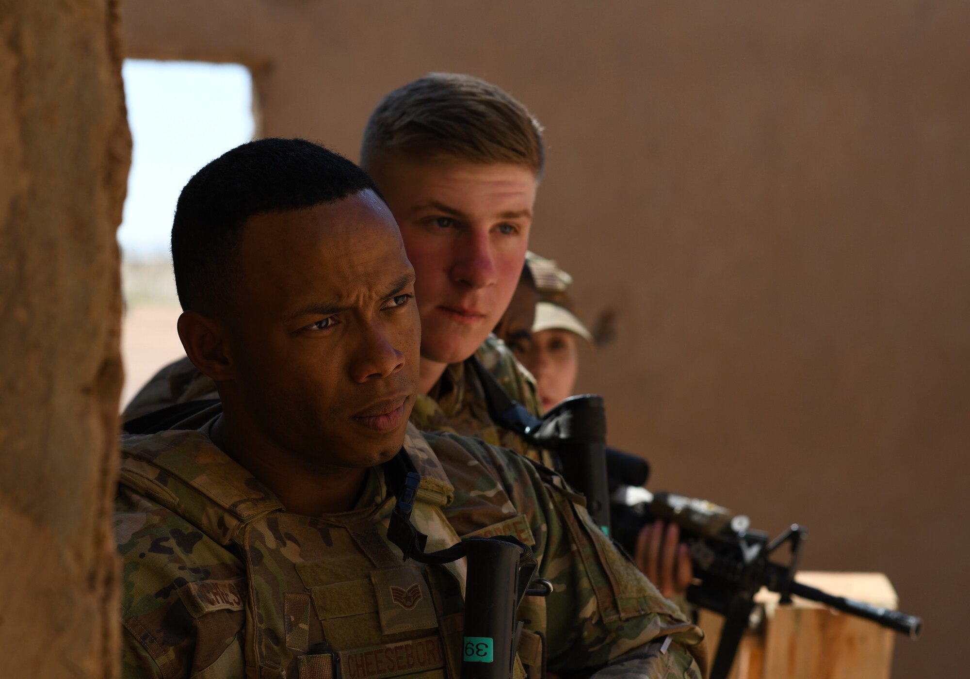 U.S. Air Force Staff Sgt. Noel Cheeseboro, from left, Airman 1st Class Ian Moran and Senior Airman Gabrielle Hamilton, 409th Expeditionary Security Forces Squadron Response Force team members, participate in a close quarters battle refresher course at Nigerien Air Base 201, Niger, Feb. 5, 2020. During the course, the Defenders brushed up on the fundamentals of weapon manipulation, room clearing, and engaging threats with bystanders and hostages. (U.S. Air Force Photo by Tech. Sgt. Alex Fox Echols III)