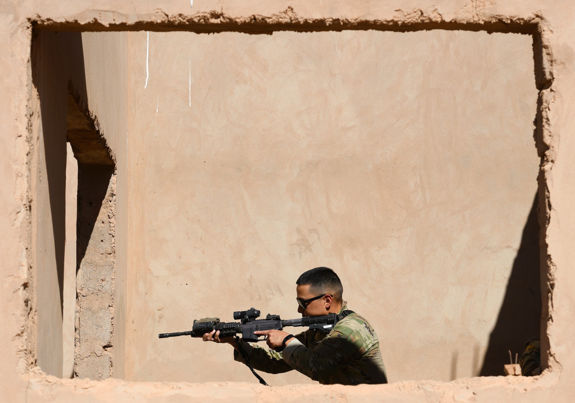 U.S. Air Force Senior Airman Brandon Troglia, 409th Expeditionary Security Forces Squadron Response Force team member, conducts building clearing procedures during a close quarters battle refresher course at Nigerien Air Base 201, Niger, Feb. 5, 2020. During the course, the Defenders brushed up on the fundamentals of weapon manipulation, room clearing, and engaging threats with bystanders and hostages. (U.S. Air Force Photo by Tech. Sgt. Alex Fox Echols III)