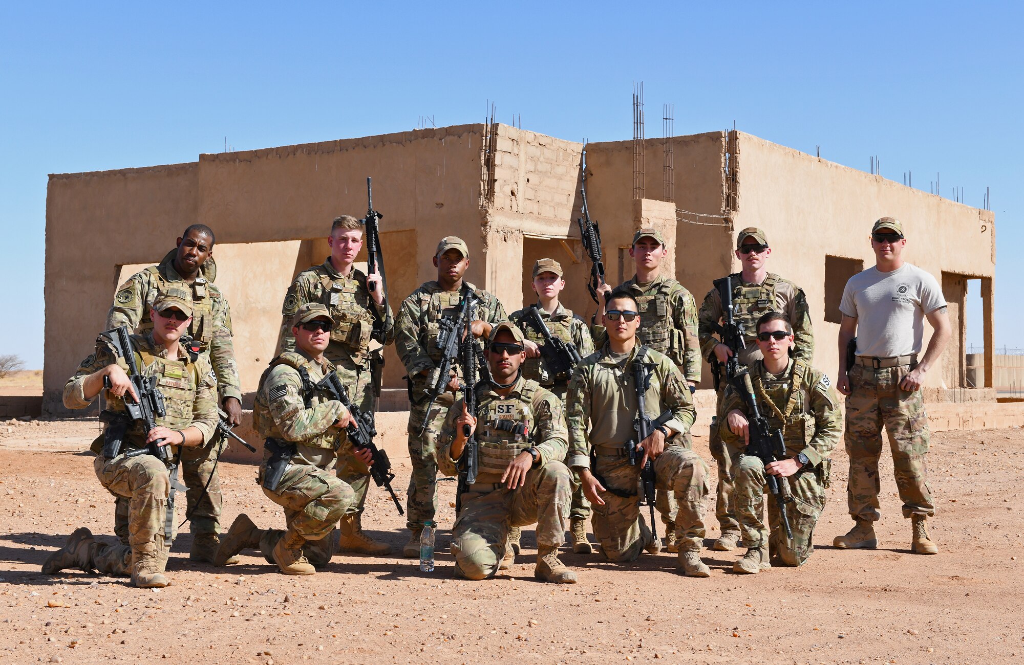 U.S. Air Force 409th Expeditionary Security Forces Squadron Response Force team members deployed to Nigerien Air Base 201 pose for a photo after a close quarters battle refresher course in Agadez, Niger, Feb. 5, 2020. During the course, the Defenders brushed up on the fundamentals of weapon manipulation, room clearing, and engaging threats with bystanders and hostages. (U.S. Air Force Photo by Tech. Sgt. Alex Fox Echols III)