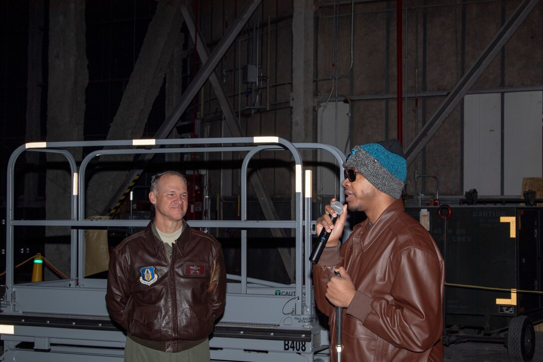U.S. Air Force Col. Stephen “Steve” Lanier, the 916th Air Refueling Wing commander, listens as Staff Sgt. Kijuan Amey, a 77th Air Refueling Squadron boom operator, speaks about his experience with KC-135 Stratotankers during the divestiture ceremony on Seymour Johnson Air Force Base, North Carolina, Feb. 8, 2020. The 916 ARW hosted the ceremony in honor of aircraft 349, the first KC-135 Stratotanker to be acquired by the 916 ARW and the last to be divested in the wing’s current conversion. (U.S. Air Force photo by Staff Sgt. Mary McKnight)