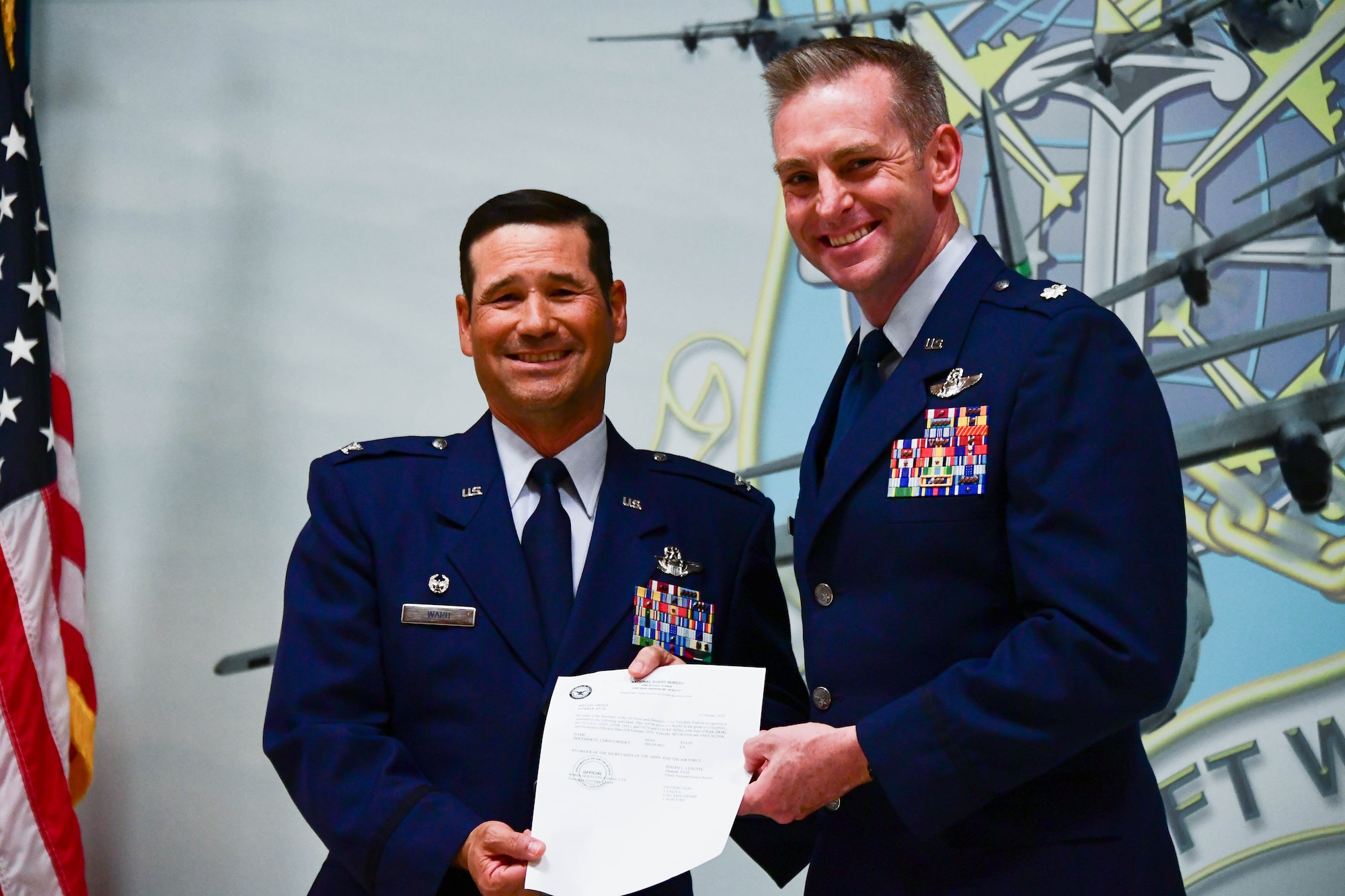 (Left) California Air National Guard Col. Keith Ward, Commander 146th Airlift Wing, presents a certificate to Air National Guard Col. Christopher Dougherty (right) at the Channel Islands Air National Guard Station, California, November 8, 2020. (U.S. Air National Guard photo by Senior Airman Michelle Ulber)