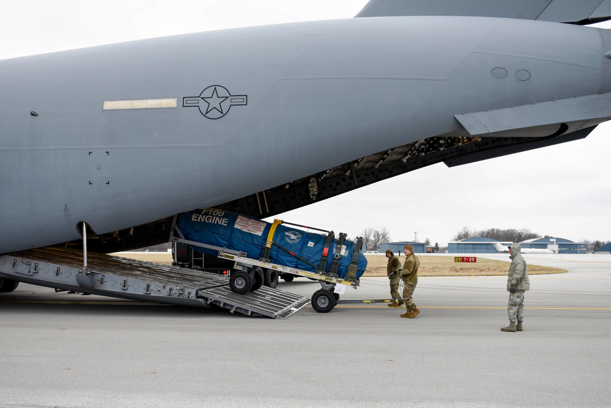 U.S. Air Force Master Sgt. Lewis Smith, the traffic management supervisor assigned to the Ohio National Guard’s 180th Fighter Wing, and U.S. Air Force Tech. Sgt. Adam Berry, a vehicle maintenance technician assigned to the 180FW, load cargo onto a C-17 assigned to the 167th Airlift Wing at the 180FW, Feb. 4, 2020. The C-17 was loaded with equipment to support the 180FW's involvement in exercise Green Flag-West. Green flag is a realistic, Air-to-Surface, joint training exercise designed to improve interoperability between aircraft while supporting ground troops by allowing U.S. military branches, as well as other NATO and allied nations, an opportunity to work together, as they would in military operations around the world.