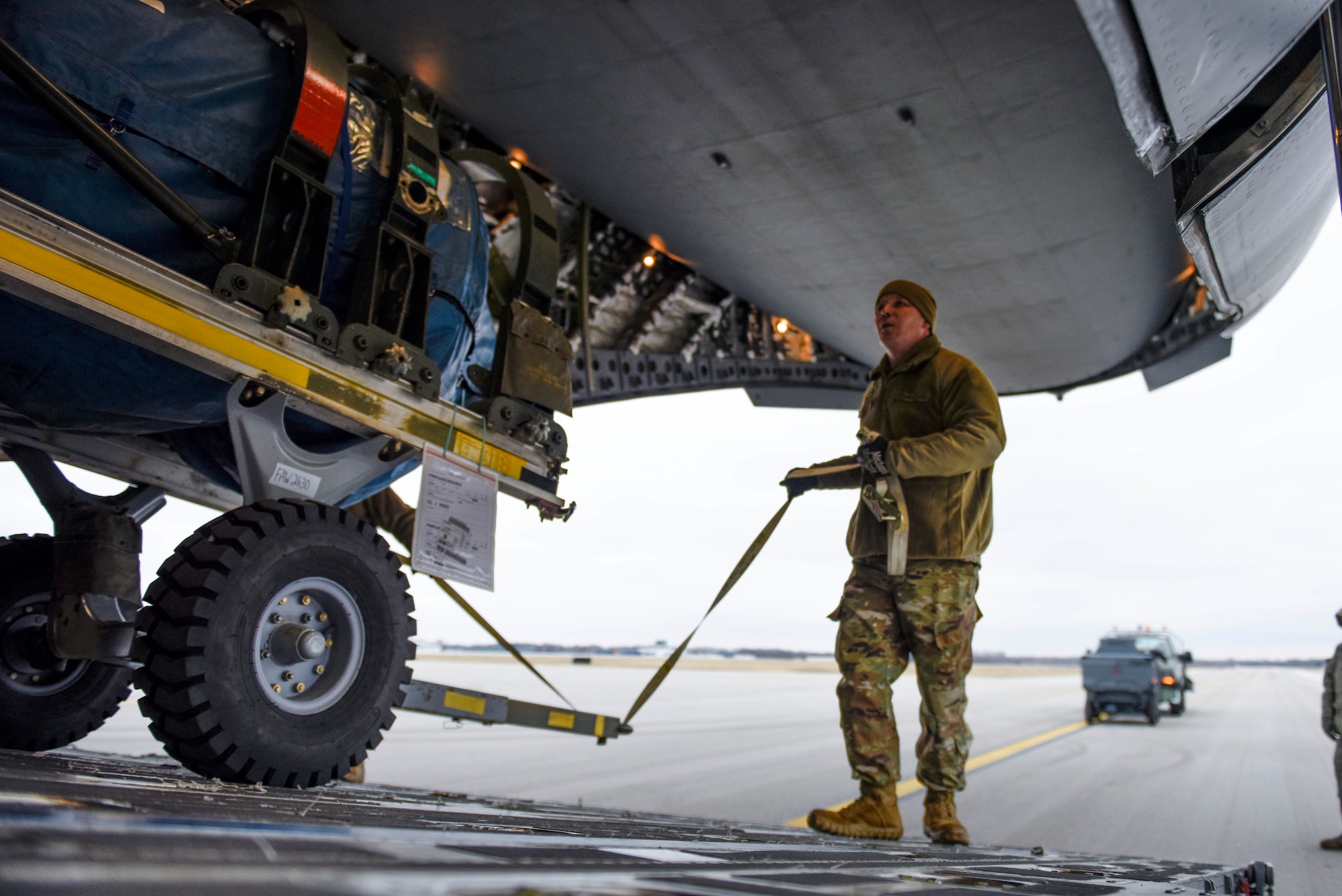 U.S. Air Force Tech. Sgt. Adam Berry, a vehicle maintenance technician assigned to the 180FW, loads cargo onto a C-17 assigned to the 167th AW at the 180FW, Feb. 4, 2020. The C-17 was loaded with equipment to support the 180FW's involvement in exercise Green Flag-West. Green flag is a realistic, Air-to-Surface, joint training exercise designed to improve interoperability between aircraft while supporting ground troops by allowing U.S. military branches, as well as other NATO and allied nations, an opportunity to work together, as they would in military operations around the world.