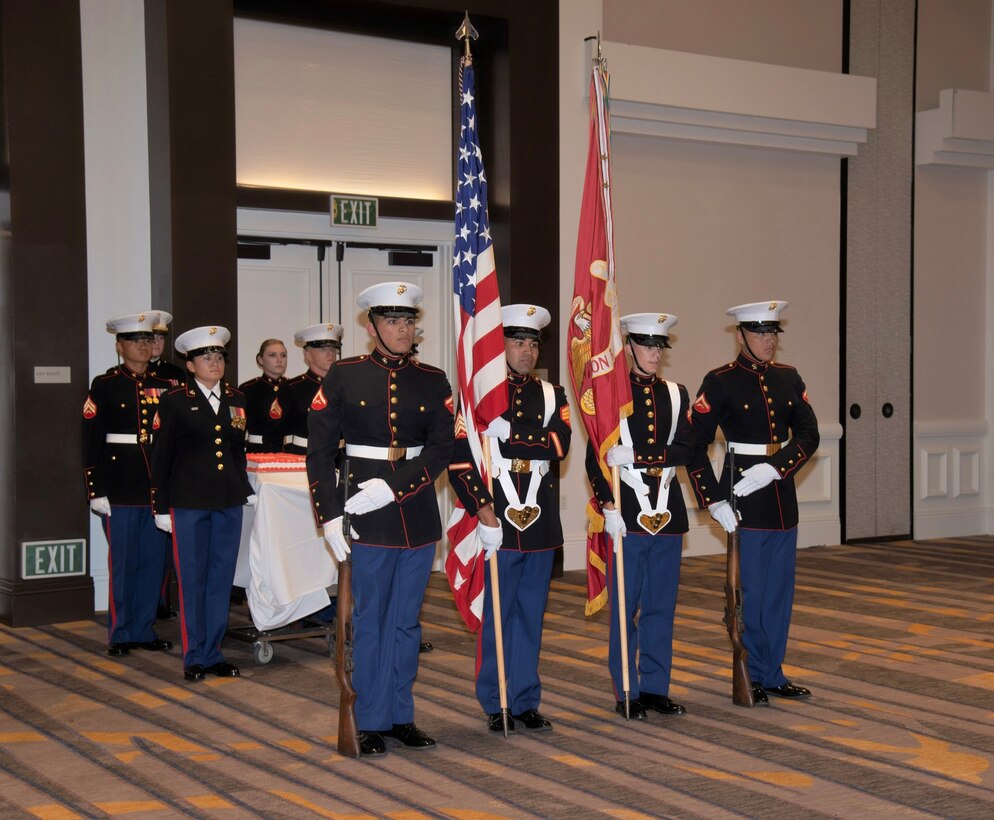 CLB-5 Marines prepare to escort birthday cake during their 244th Marine Corps' birthday ball ceremony.