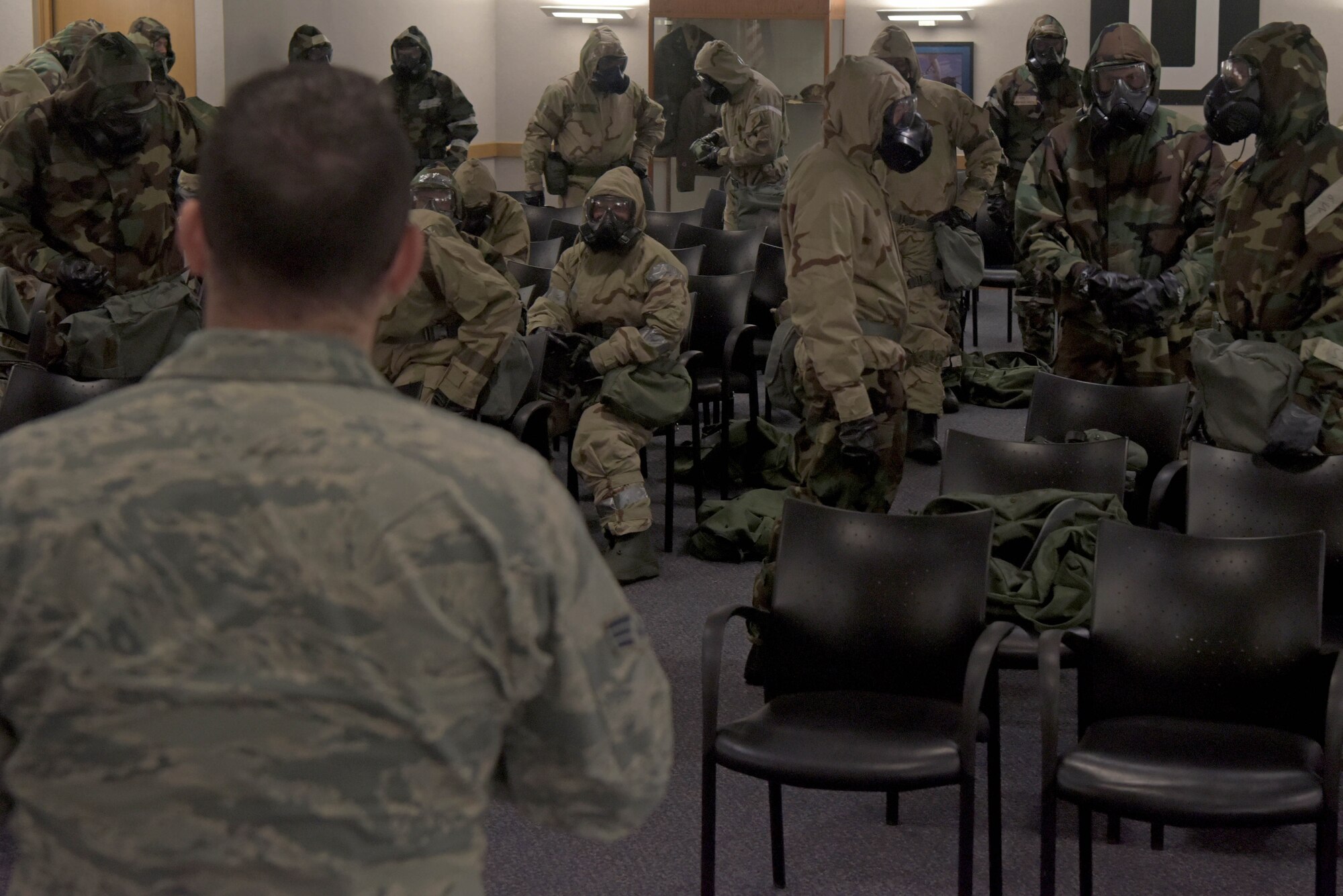 Senior Airman Devin Sova, 100th Civil Engineer Squadron emergengy management journeyman, gives instructions during chemical, biological, radiological, nuclear and explosive training in preparation for an upcoming exercise which will include agile combat concepts at RAF Mildenhall, England, Feb. 7, 2020. Agile Combat Employment calls for forces to have the ability to seize, retain and exploit the initiative against an adversary in any environment. (U.S. Air Force photo by Senior Airman Benjamin Cooper)