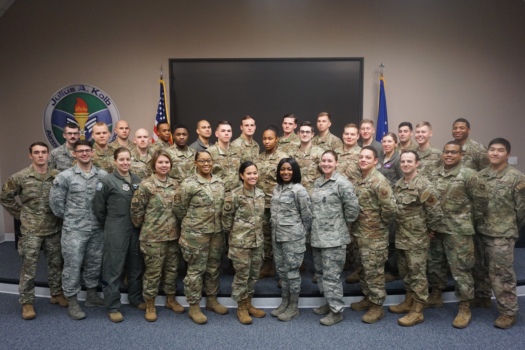 Graduates of Airman Leadership School Class 20-B stand for a group photo.