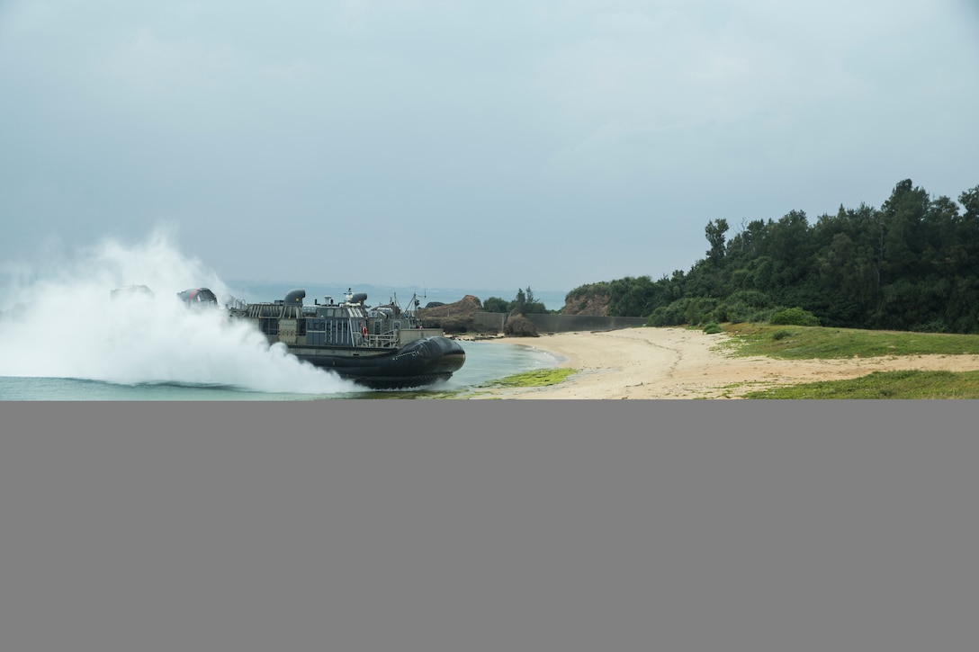 Landing Craft Air Cushion 09 assigned to Naval Beach Unit 7 arrives on the shoreline after Marines with Charlie Company, Battalion Landing Team, 1st Battalion 5th Marines, 31st Marine Expeditionary Unit, and Japanese service members with the Amphibious Rapid Deployment Brigade secured the beach during a bilateral small-boat raid on Kin Blue, Okinawa, Japan, Feb. 9.