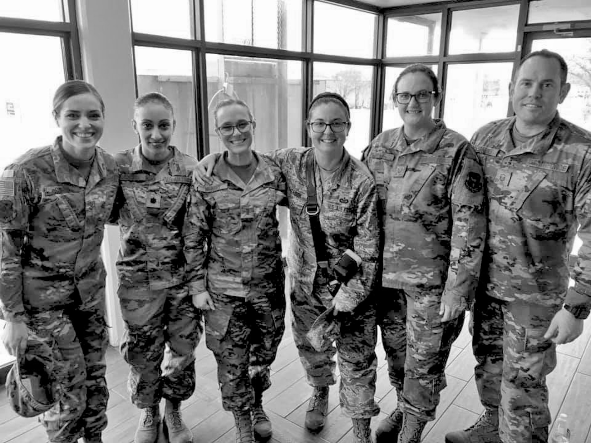 Members of the 507th Air Refueling Wing Public Affairs office stand for a photograph Feb. 9, 2020, at Tinker Air Force Base, Oklahoma. They spent five months compiling, scanning and digitally archiving more than 30 years of unit newspapers and made them available to the public in January. (U.S. Air Force photo by Tech. Sgt. Ronald Delay)