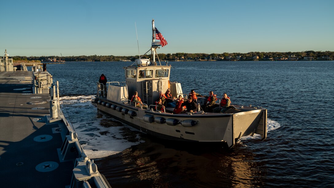 U.S. Marines and Sailors depart from Blount Island Command, Florida on a tender boat to the USNS Lopez (T-AK 3010) to begin Maritime Prepositioning Force Exercise 20, Feb. 8, 2020. MPFEX 20 is a military exercise in which Marines and Sailors worked together to offload and process military equipment from a single MPF ship, the U.S. Naval Ship Lopez. The exercise is a rehearsal of the Marines and Sailors’ ability to conduct safe, efficient offloads while in a tactical environment while working in close coordination with their 2nd and 6th Fleet counterparts to enhance the rapid and scalable deployment of naval expeditionary forces in European theaters. (U.S. Marine Corps photo by Cpl. Rachel K. Young-Porter)