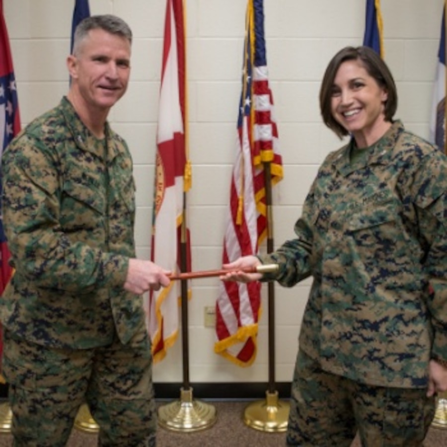 U.S. Marine Corps Col. John Neville Jr., left, program manager for Small Tactical Unmanned Aircraft Systems Program Office (PMA-263), hands a gift to Lt. Col. Tegan Owen, commanding officer of Center for Naval Aviation Technical Training, during a ribbon cutting ceremony at MCAS Cherry Point, North Carolina, Feb. 10, 2020. There ceremony announced the opening of the RQ-21A Blackjack maintenance course which has not been instructed through the United States Marine Corps until now. The technological and systematic advancement and evolutions will now be experienced firsthand by all Sailors and Marines who are taught in this military occupational specialty at MCAS Cherry Point Center for Naval Aviation Technical Training. (U.S. Marine Corps photo by Cpl. Micha Pierce)