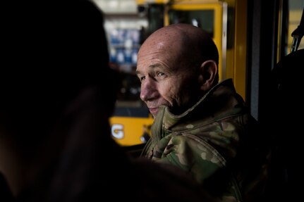 U.S. Air Force Gen. Mike Holmes, the commander of Air Combat Command, speaks with a 633rd Civil Engineer Squadron Airman at Joint Base Langley-Eustis, Virginia, Feb. 7, 2020.
