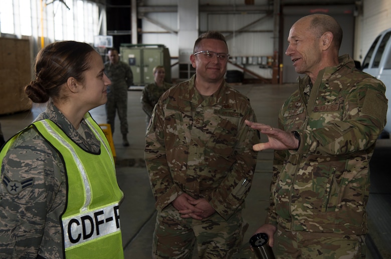 U.S. Air Force Gen. Mike Holmes, the commander of Air Combat Command, and Chief Master Sgt. David Wade, the command chief of ACC, speak with Airman 1st Class Jonea Davis, 733rd Logistics Readiness Squadron repetitive, at Joint Base Langley-Eustis, Virginia, Feb. 7, 2020.