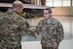 U.S. Air Force Gen. Mike Holmes, commander of Air Combat Command, presents a coin to Staff Sgt. Thomas Watt, 27th Fighter Squadron avionics systems craftsman, at Joint Base Langley-Eustis, Virginia, Feb. 6, 2020.