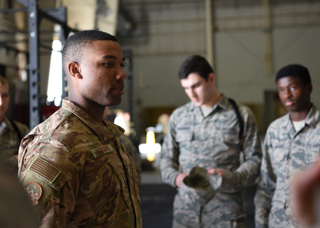 U.S. Air Force Staff Sgt. Nigel Jaggard, 315th Training Squadron assisting military training leader, motivates the 315th TRS student drill team before they compete in the 17th Training Group Drill Competition at the Louis F. Garland Department of Defense Fire Academy High Bay on Goodfellow Air Force Base, Texas, Feb. 7, 2020.  Jaggard trained with the 315th TRS drill team for several months before the event. (U.S. Air Force photo by Airman 1st Class Abbey Rieves)