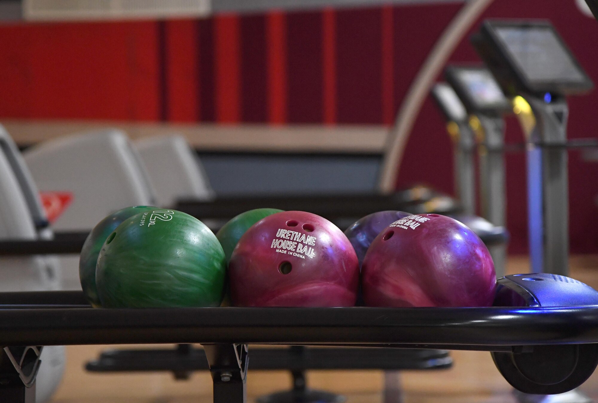 Bowling balls are displayed during the grand re-opening of the Gaude Lanes Bowling Center at Keesler Air Force Base, Mississippi, Feb. 7, 2020. Renovations in the 11th Frame Cafe includes more space, new furniture and light fixtures and the addition of a grab-n-go section. (U.S. Air Force photo by Kemberly Groue)