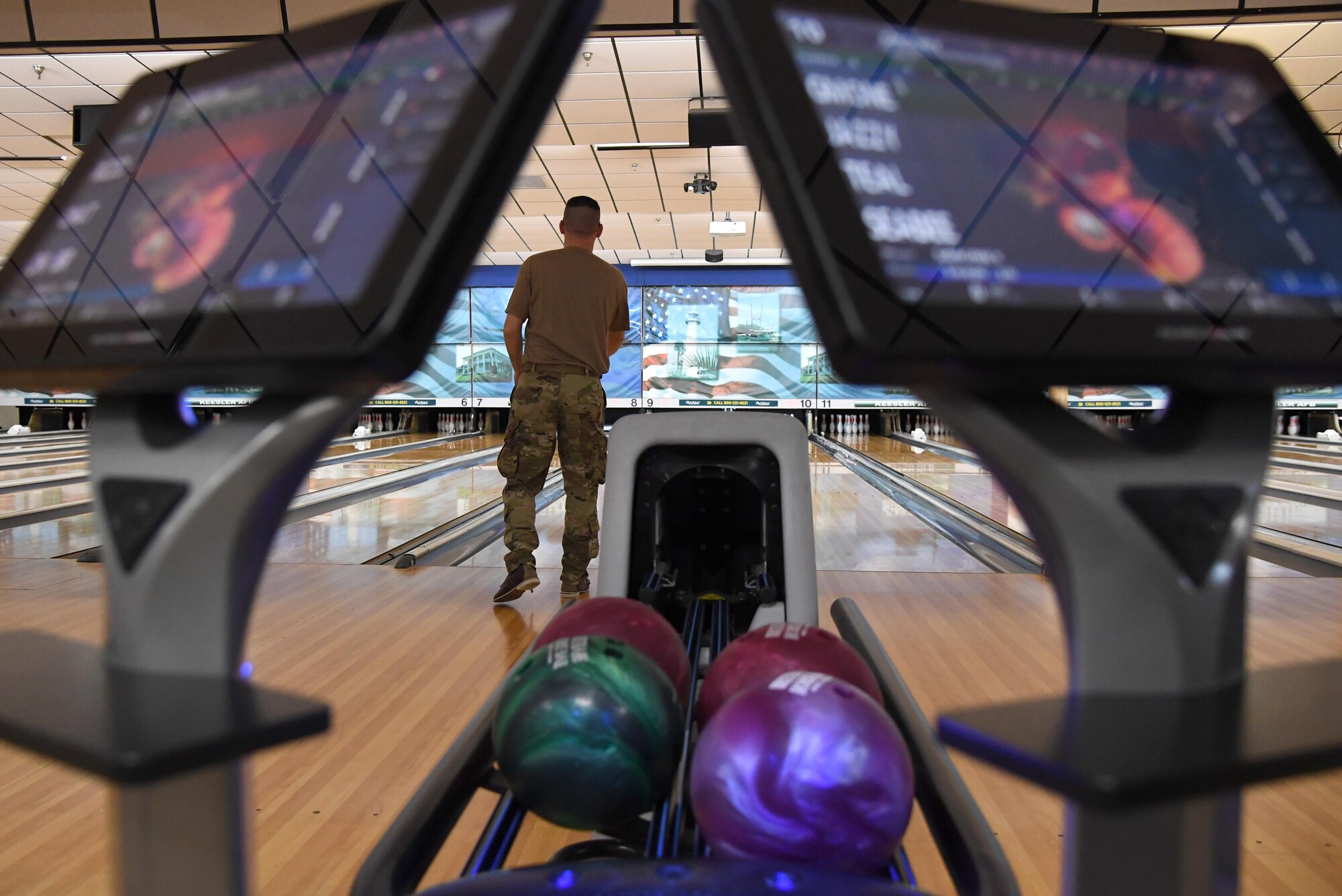 U.S. Air Force Tech. Sgt. John Rizzuto, 403rd Security Forces Squadron fire team leader, bowls during the grand re-opening of the Gaude Lanes Bowling Center at Keesler Air Force Base, Mississippi, Feb. 7, 2020. Renovations in the 11th Frame Cafe includes more space, new furniture and light fixtures and the addition of a grab-n-go section. (U.S. Air Force photo by Kemberly Groue)