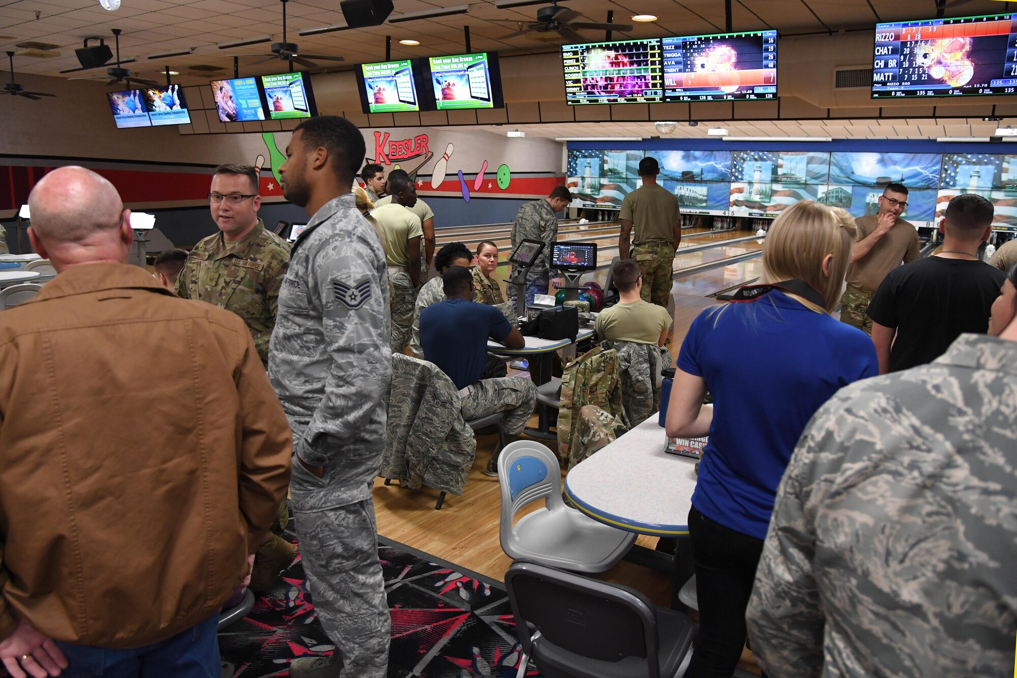 Keesler personnel gather during the grand re-opening of the Gaude Lanes Bowling Center at Keesler Air Force Base, Mississippi, Feb. 7, 2020. Renovations in the 11th Frame Cafe includes more space, new furniture and light fixtures and the addition of a grab-n-go section. (U.S. Air Force photo by Kemberly Groue)