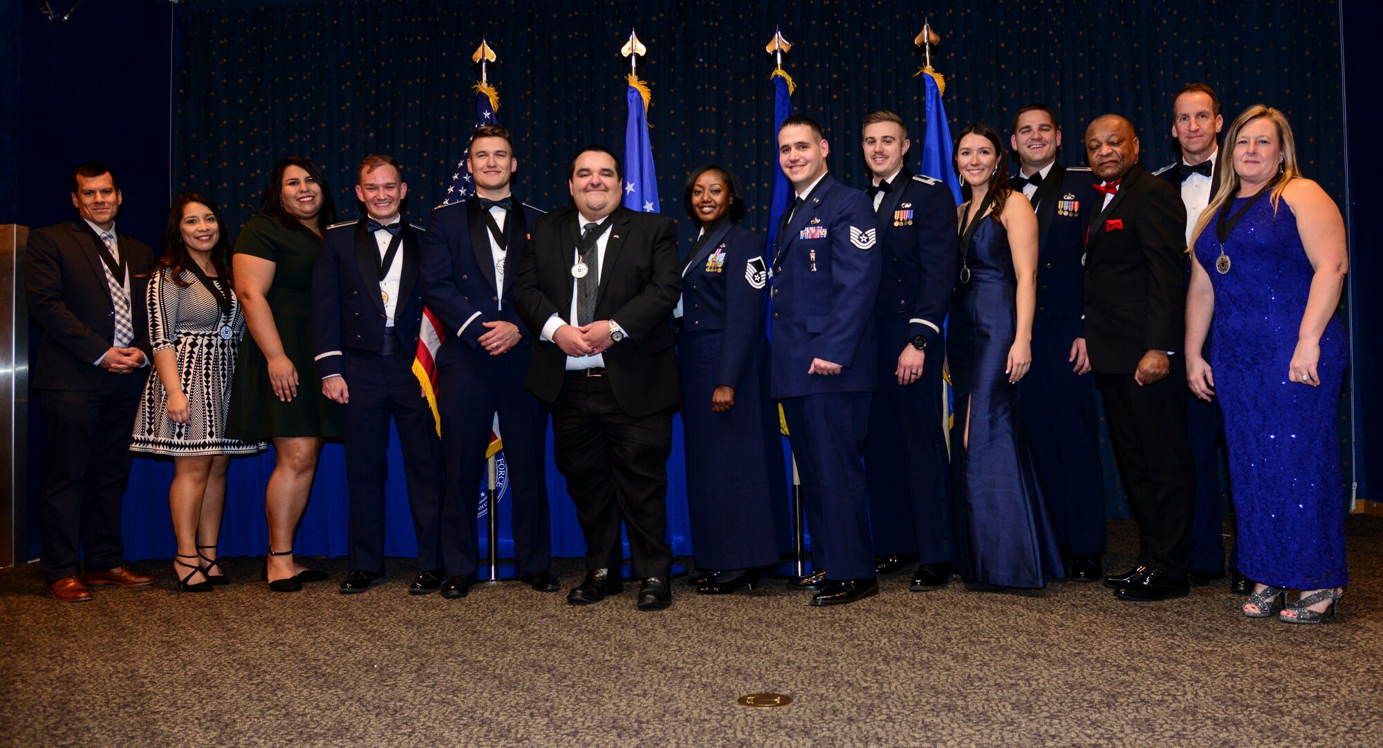 The Air Force Nuclear Weapons Center commander, Maj. Gen. Shaun Morris, congratulates the center’s annual award winners at a ceremony on Jan. 23, 2020, at the Mountain View Club, Kirtland AFB, New Mexico.  Pictured left to right: William Ramos; Paola Banuelos; Gabriella Gutierrez; 1st Lt. Andrew Miller; 2nd Lt. MacKenzie Lerum; Jonathan Holguin; Master Sgt. Latoya Saxton; Technical Sgt. Robert Jovin; Capt. Blake Branton; Katherine Schneider; Maj. Christopher Ifft; Clarence Perry; Morris; and Michelle Rivera. See story for complete list of winners. (Air Force photo by Senior Airman Alexandria Crawford)