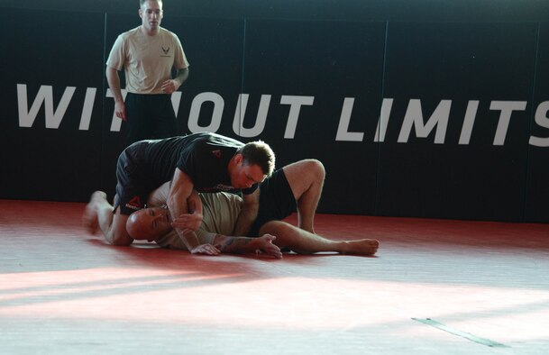 Special warfare Airmen and UFC fighter Forrest Griffin conduct a grappling workout during a fliming at the Ultimate Fighter Championship Performance Institute in Las Vegas, Nevada