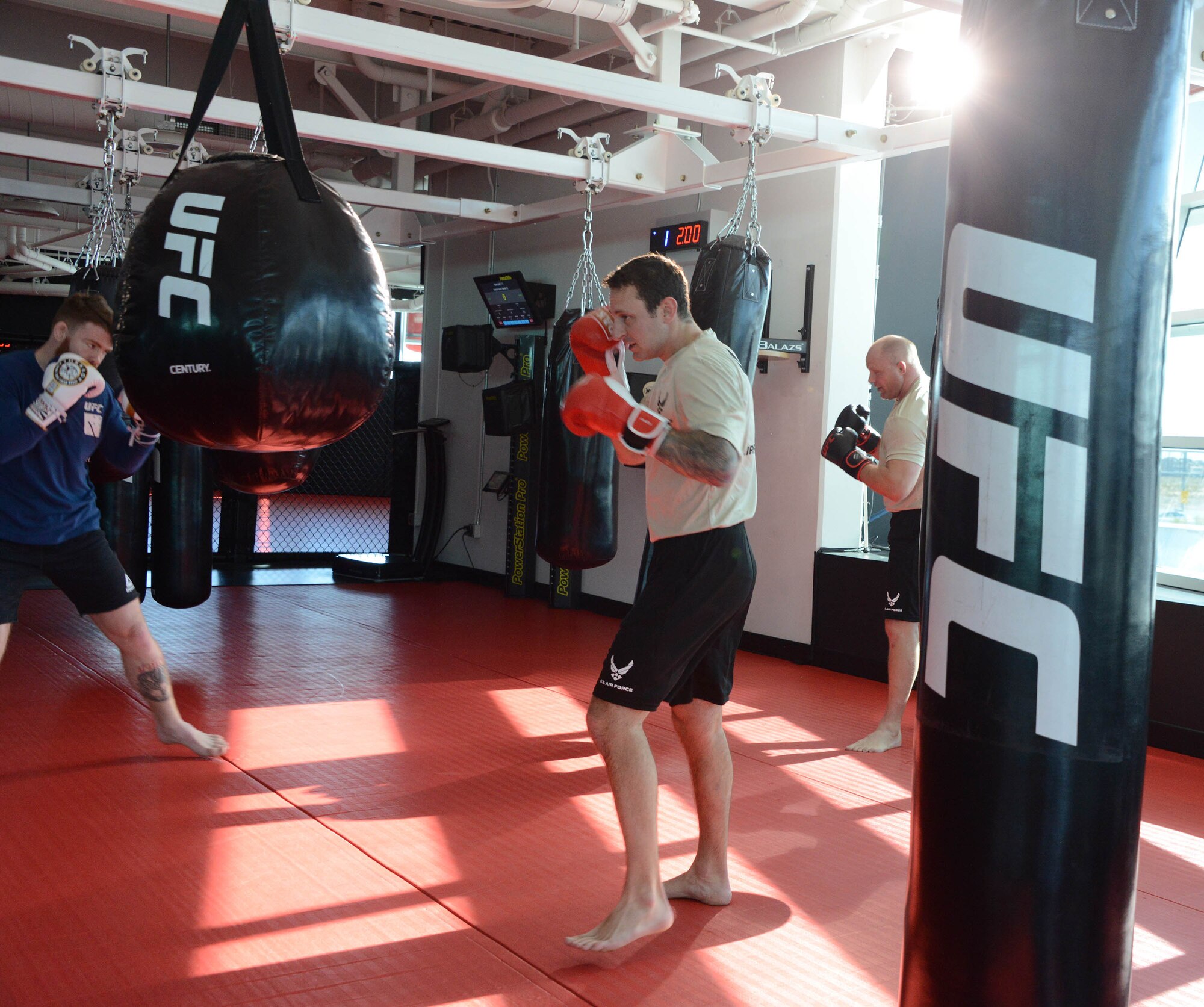 UFC fighter Paul Felder and a pair of special warfare Airmen conduct a grueling punching bag workout during a filming at the Ultimate Fighting Championship Performance Institute in Las Vegas, Nevada.