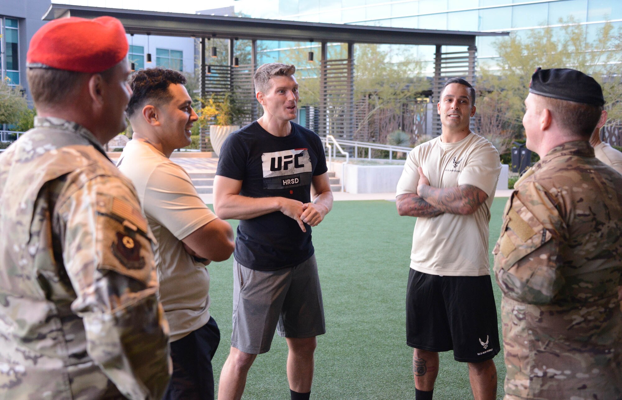 Special warfare Airmen share stories with UFC fighter Stephen Thompson during a filming at the Ultimate Fighting Championship Performance Institute in Las Vegas, Nevada.