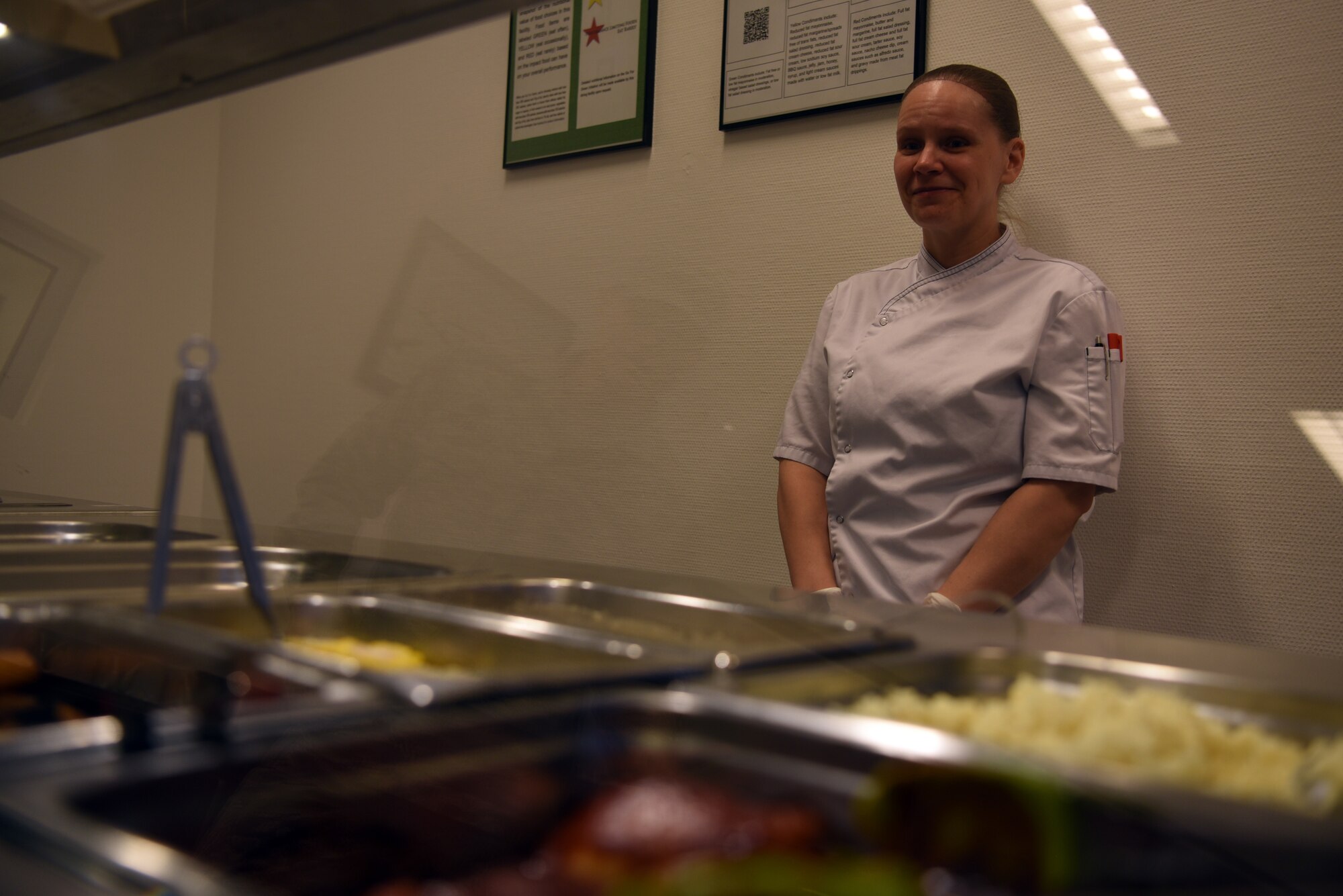 Monja Kollan, 786th Force Support Squadron chef, is ready to serve customers of the Jawbone Flight Kitchen at Ramstein AIr Base, Germany, Feb. 6, 2020.