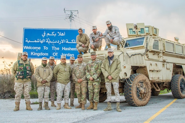 Jordan Armed Forces-Arab Army (JAF) Soldiers pose for a photo with Military Engagement Team-Jordan, 158th Maneuver Enhancement Brigade, Arizona Army National Guard, during a Mine Resistant Ambush Protected Wheeled Armor Vehicle Subject Matter Expert Exchange at a base outside of Amman, Jordan in January. The U.S. military has a long-standing relationship with Jordan to support our mutual objectives by providing military assistance to the JAF consistent with our national interests. (U.S. Army photo by Sgt. 1st Class Shaiyla B. Hakeem)