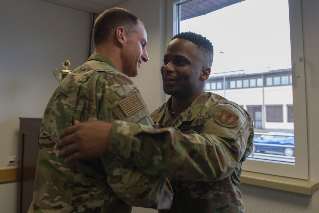 U.S Air Force Col. Matt Husemann, 86th Airlift Wing vice commander, left, congratulates Tech. Sgt. Marcus Bias, 86th AW equal opportunity specialist, on being the Airlifter of the Week at Ramstein Air Base, Germany, Jan. 30, 2020. Bias was recognized for going above and beyond to make the 86th AW the World’s Best Wing.