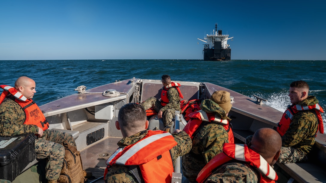 U.S. Marines and Sailors travel to the USNS Lopez (T-AK 3010) by the ship’s tender boat to begin Maritime Prepositioning Force Exercise 20, in the Atlantic Ocean, Feb. 9, 2020. MPFEX 20 is a military exercise in which Marines and Sailors work together to offload and process military equipment from a single MPF ship, the USNS Lopez (T-AK 3010). The exercise is a rehearsal of the Marines and Sailors’ ability to conduct safe, efficient offloads while in a tactical environment while working in close coordination with their 2nd and 6th Fleet counterparts to enhance the rapid and scalable deployment of naval expeditionary forces in European theater. (U.S. Marine Corps photo by Cpl. Rachel K. Young-Porter)