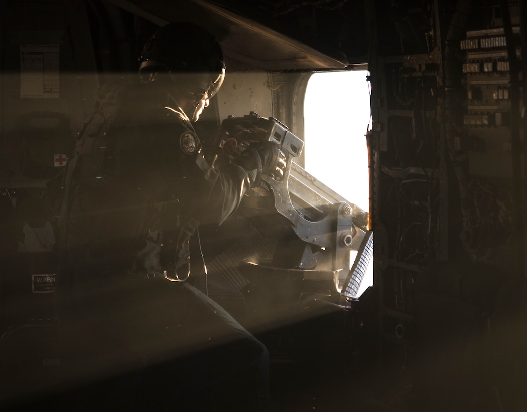 U.S. Marine Corps Staff Sgt. Robert Wills fires a M2 machine gun from a CH-53E Super Stallion with Marine Heavy Helicopter Squadron 464 during a deployment for training in Savannah, Georgia, Feb. 5.