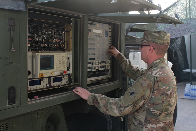 Spc. Zachary Heath, 198th Expeditionary Signal Battalion (ESB), operates the phoenix satellite during the monthly validation testing. Validation testing occurs every month to ensure that all communication equipment functions properly and also allows Soldiers to evaluate the communication systems and strive for continuous improvement to better support their end users.