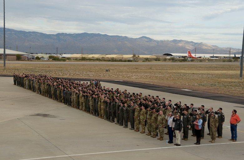 A group of Airmen stand in formation