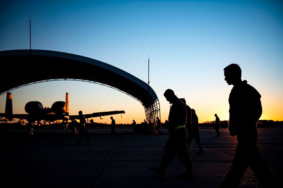 Photo of Airmen conducting a foreign object debris walk.