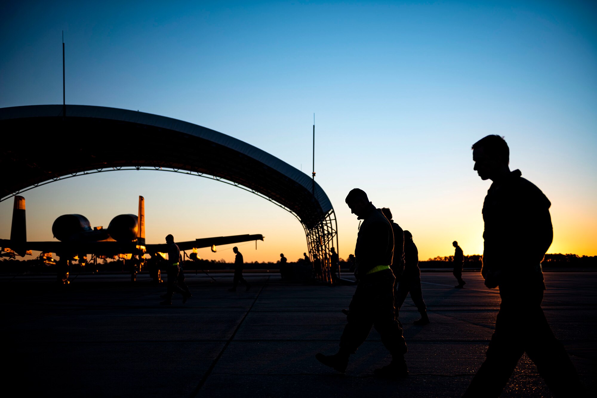 Photo of Airmen conducting a foreign object debris walk.