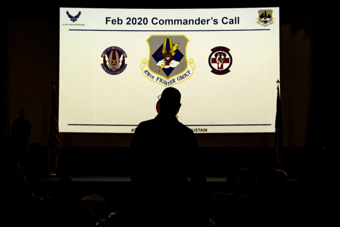 Photo of a commander walking to a stage.