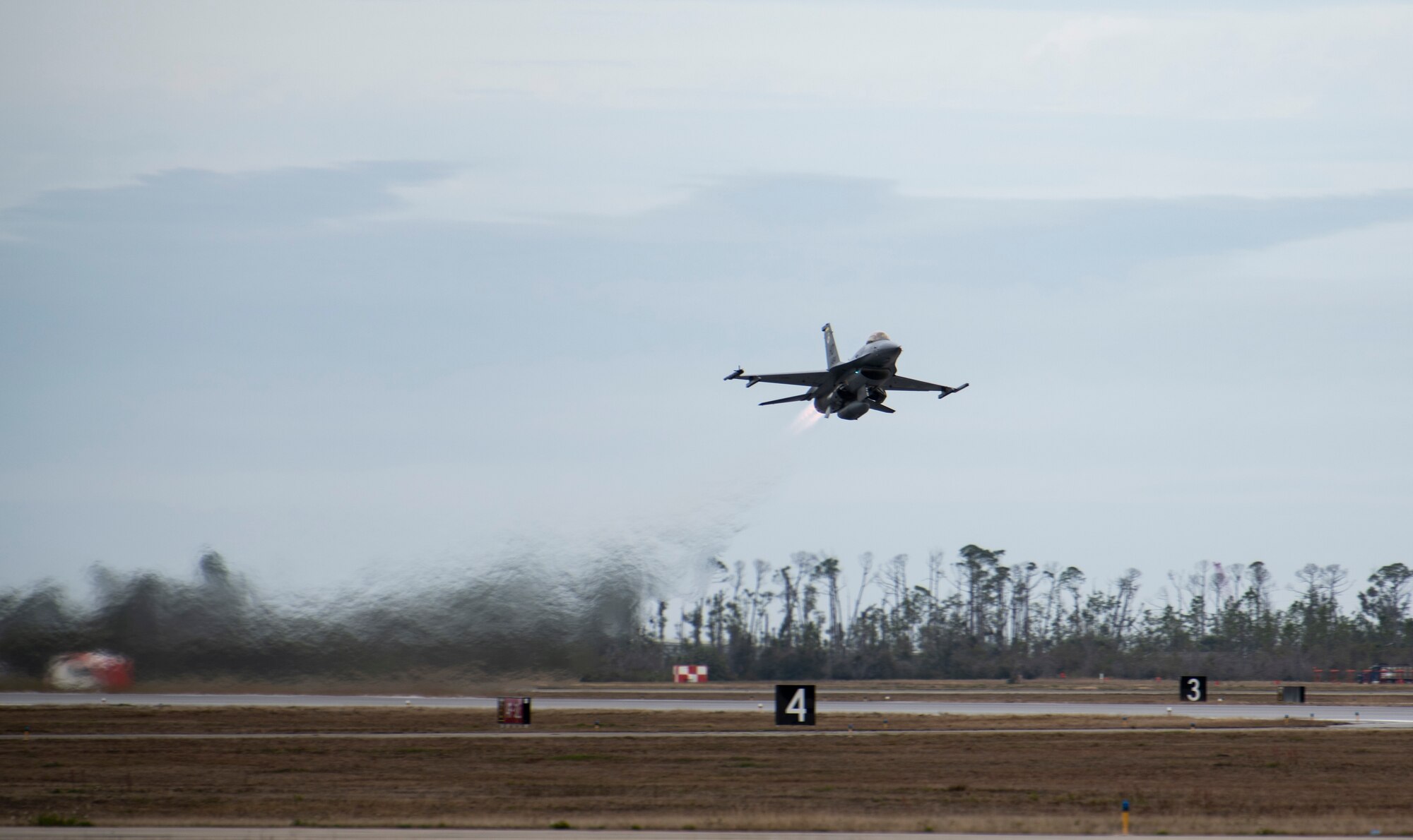 A U.S. Air Force F-16 Fighting Falcon from Holloman Air Force Base, N.M., takes off for a training flight at Tyndall Air Force Base, Fla., Feb. 4, 2020. Tyndall is one of the few bases in the Department of Defense that has access to the Eastern Gulf of Mexico training airspace, which is often used for air combat training and live missile testing. (U.S. Air Force photo by Senior Airman Stefan Alvarez)