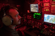 A U.S. Air Force 96th Bomb Squadron weapons systems officer monitors aircraft screens on a U.S. Air Force 2nd Bomb Wing B-52H Stratofortress during training and integration with the Royal Norwegian Air Force in support of Bomber Task Force Europe 20-1, Nov. 6, 2019, in Norwegian airspace. This deployment allows aircrews and support personnel to conduct theater integration and to improve bomber interoperability with joint partners and allied nations. (U.S. Air Force photo by Tech. Sgt. Christopher Ruano)
