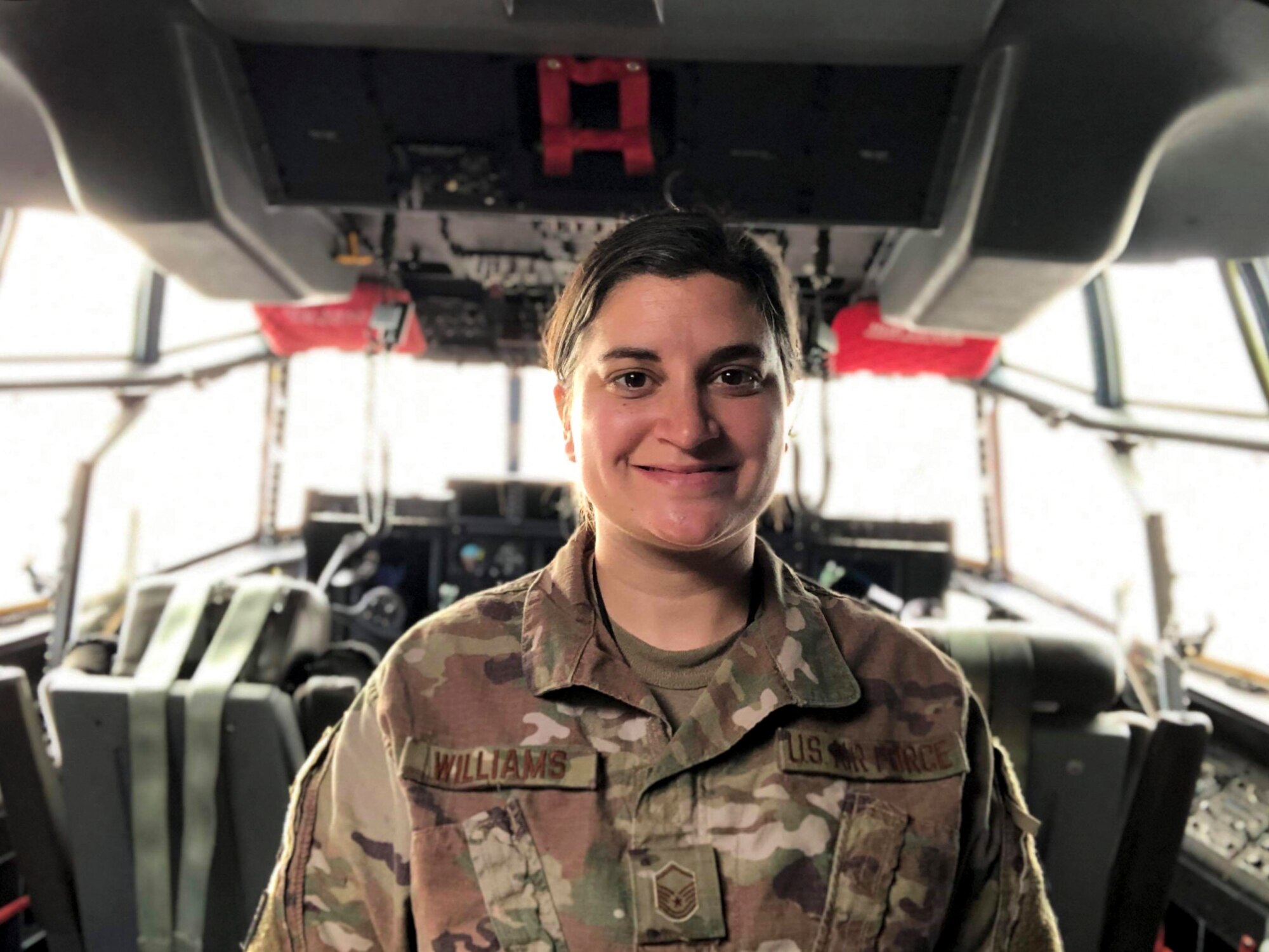 Master Sgt. Katie Williams, 803rd Aircraft Maintenance Squadron instrument and flight control systems craftsman, poses for a photo Feb. 10 on the flight deck of a C-130J Super Hercules aircraft. Williams was the wing’s SNCO of the 4th quarter recipient. (Courtesy photo)