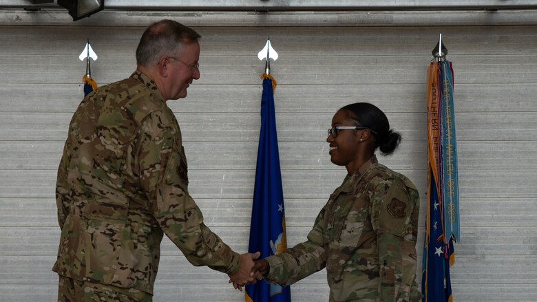 Tech. Sgt. Raven Crockett (right), 403rd Logistics Readiness Squadron quality assurance noncommissioned officer in charge, shakes hand with Col. Jeff Van Dootingh, 403rd Wing commander (left), during a Commander’s Call Feb. 8 at Keesler Air Force Base, Miss. Crockett was the wing’s NCO of the 4th quarter recipient. (U.S. Air Force photo by Staff Sgt. Shelton Sherrill)