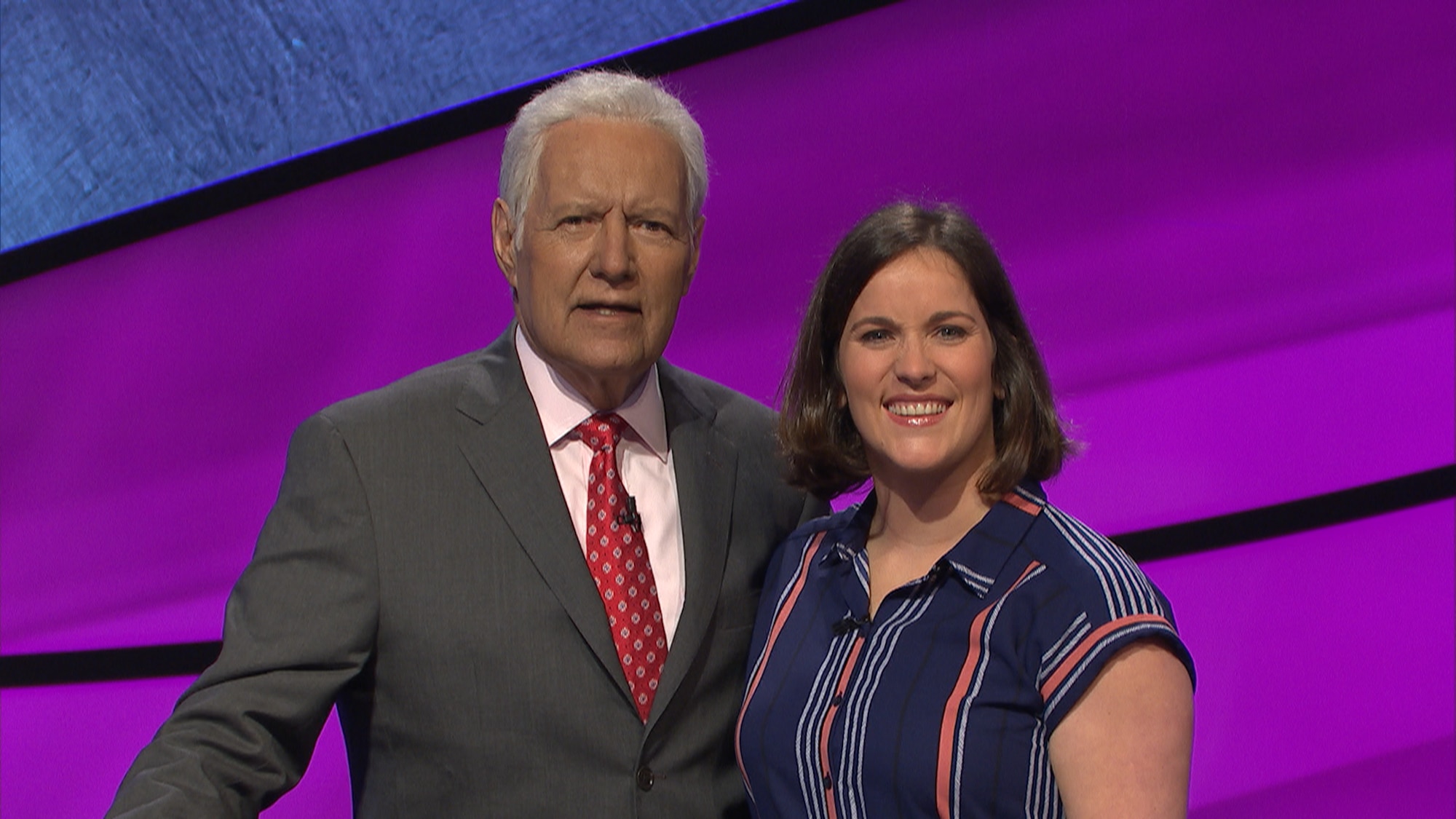 Mrs. Danyelle Long-Hyland, lab instructor assigned to United States Army Medical Research Institute of Infectious Disease, poses with Jeopardy host Alex Trebek. (courtesy photo)