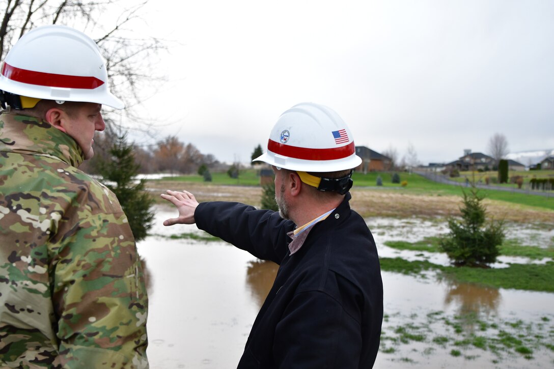 Lt. Col. Christian Dietz, Commander of the Walla Walla District Corps of Engineers, and the District's Chief of Engineering, Dwayne Weston, oversee Russel Creek in Walla Walla.