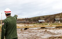 Corps official monitoring flows in the Mill Creek Channel.