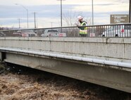 Corps official monitoring flows in the Mill Creek Channel.