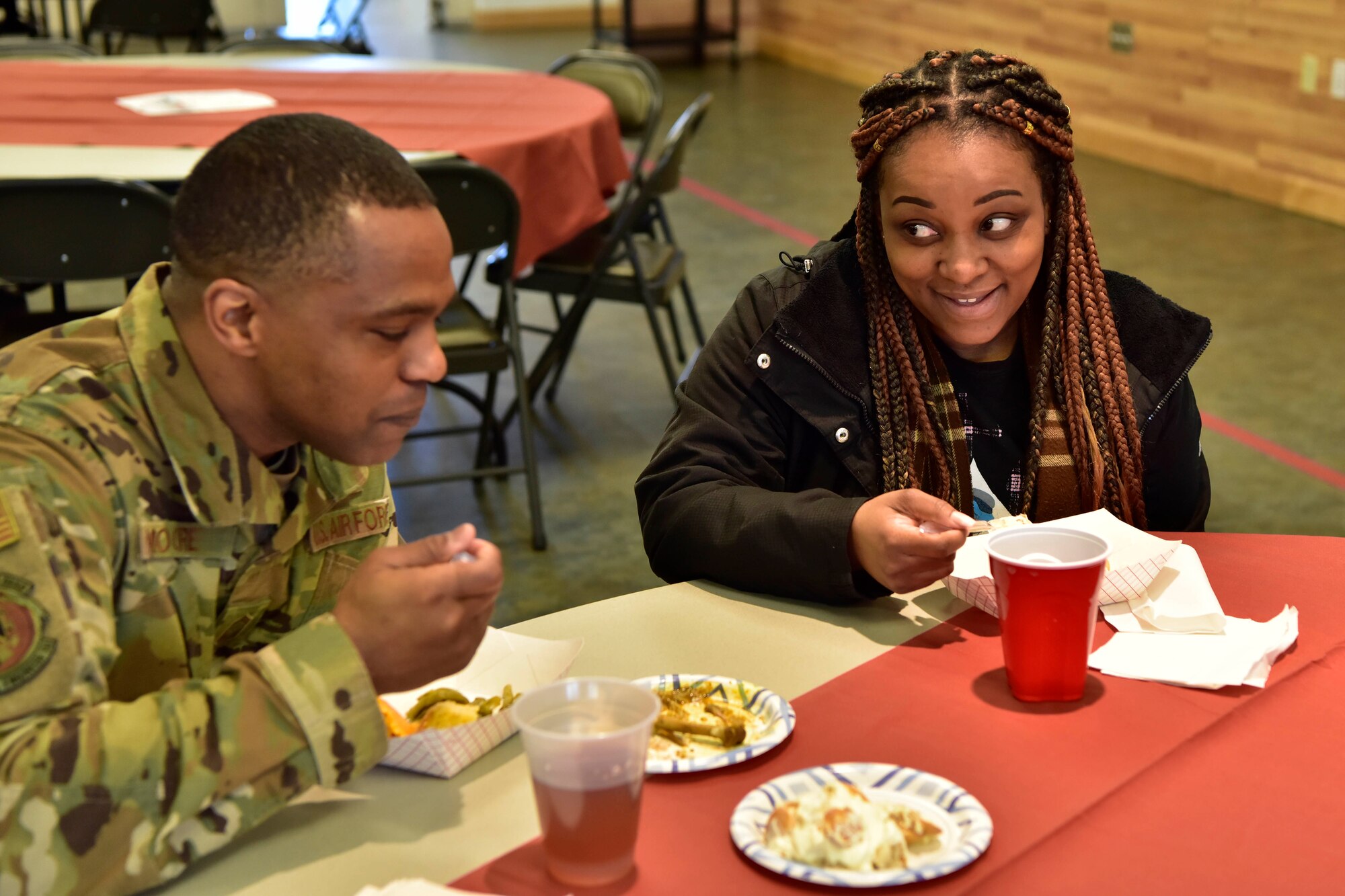 Airmen enjoy chicken curry with red beans and rice during A Taste of Culture event for Black History Month on Eielson Air Force Base, Alaska, Feb. 3, 2020. The event centered around Airmen tasting different African American dishes. (U.S. Air Force photo by Senior Airman Beaux Hebert)