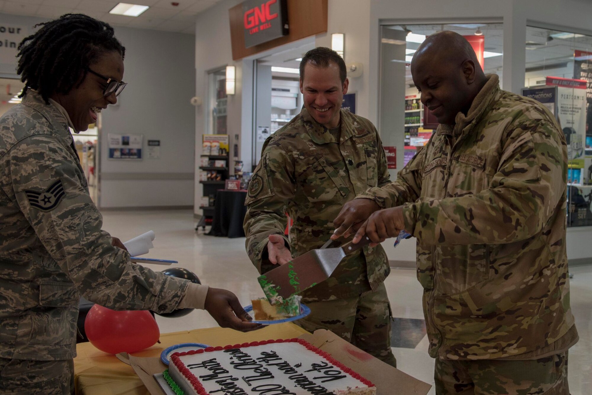 Airmen from the 354th Fighter Wing enjoy cake during the 2020 Black History Month Kickoff on Eielson Air Force Base, Alaska, Feb. 3, 2020. The council held two events during the month to celebrate African American achievements and advancements. (U.S. Air Force photo by Airman 1st Class Aaron Larue Guerrisky)